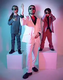 DMK band photo, 2012. Milah Schrader (left), Malka Mikkelsen (center), Korben Schrader (right).