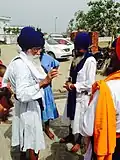 Men wearing modern chola