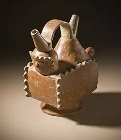 Double spout and strap handle vessel with a mythological figure; 400–1200; slip-painted ceramic; height: 19.37&nbsp;cm (75⁄8 in.), width: 19.05&nbsp;cm (71⁄2 in.), depth: 10.32&nbsp;cm (41⁄16in.); Yotoco stage; Los Angeles County Museum of Art