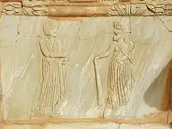 Two standing figures