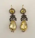 Pendeloque-shaped earrings, with pendeloque cut yellow topazes and small rose cut diamonds.