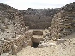 A Descending passage in the midst of ruined walls