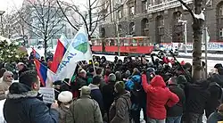 Organisers with media crew in front of the building of the government of Serbia on 12 January 2022