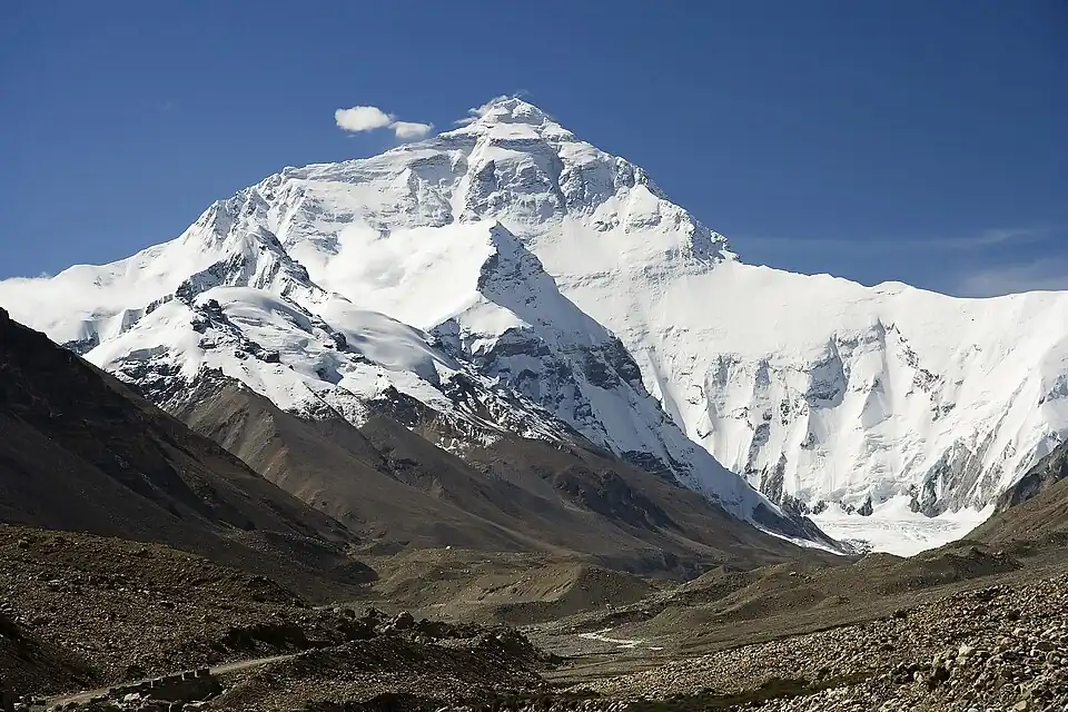 Image 14 Mount Everest Photo credit: Luca Galuzzi The north face of Mount Everest, as seen from Tibet. Everest is the highest mountain on Earth, as measured by the height of its summit above sea level, which is 8,848 metres (29,029 ft). In 1865, Everest was given its official English name by the Royal Geographical Society upon recommendation of Andrew Waugh, the British Surveyor General of India at the time. More selected pictures