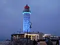 Lighthouse of Patras illuminated at night.
