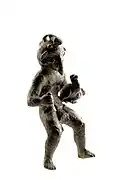 Bronze figurine of Mercury with three phalluses, with rooster in the left hand and money bag in the right hand, 100 to 250 A.D., found in Tongeren, ca 8.8&nbsp;cm Gallo-Roman Museum (Tongeren)