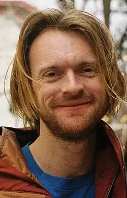 O'Conell facing head on to the camera with a slightly parted lip smile