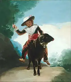 Niño montando un carnero