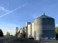 The Rockford Grain Growers Freeman Elevator with State Route 27 to the left.