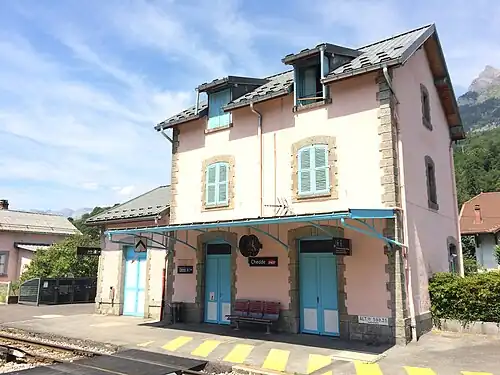 Three-story building with gabled roof
