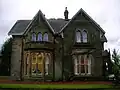 The side of the house which faces Geilsland Road and Spier's school grounds.
