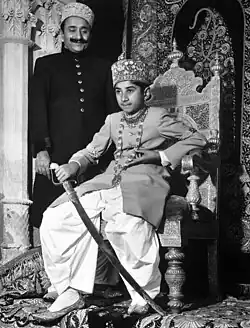 Talpur meers wearing Sherwanis and unique circular embroidered caps.
