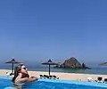 A hotel pool next to the island