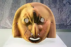 A greek mask in terracotta