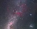 The Gum Nebula is visible as the faint large red nebula in this image.