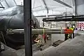 Torpedo 613 being loaded into HSwMS Neptun Inside the museum on 31 July 2013.