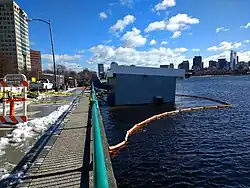 The Harvard Sailing Center in Cambridge, Massachusetts partially sinking into the Charles River during the Nor'easter.