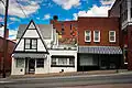 213 Second Avenue was built in the 1930s in the Arts and Crafts style and long served as a diner. It currently houses Lucky Rivers Cafe and Catering.