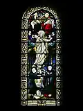 Stained glass window behind the altar