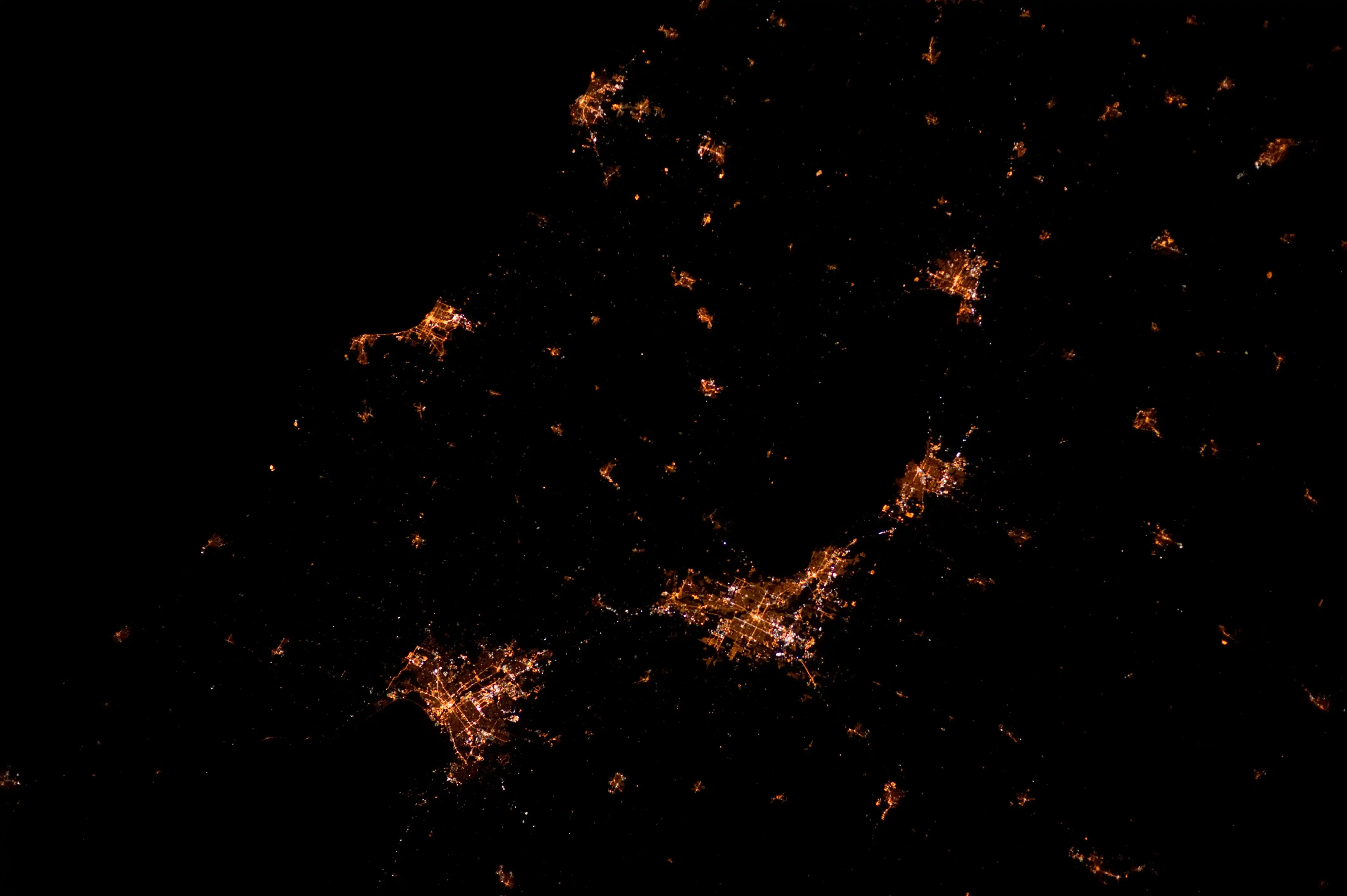 Taken at 3:09:47 A.M. CDT on March 28, 2012 from an altitude of 211 nautical miles (391 km) during ISS Expedition 30. Clockwise, from lower left: Green Bay, Manitowoc/Two Rivers, Sheboygan, Fond du Lac, Oshkosh, Appleton/Neenah/Menasha (Fox Valley).