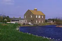 A house by a backwater of the Tay estuary