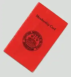 A small red cardstock booklet bearing the text, "Membership Card", and an IWW globe insignia.