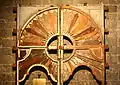 Old Mudejar-style hardwood door currently displayed under the choir loft