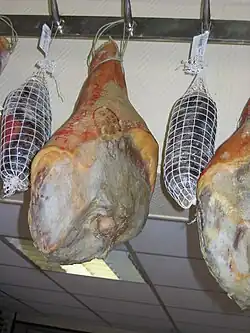 Hams and knuckles of ham after maturing, hanging, ready for sale