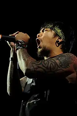 Garcia performing with Slapshock at the University of the Philippines in 2011.