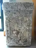 Altar found at the La Tonnelle site, text blurred by exposure to weather.[32] Sandstone, musée de Jublains[33]