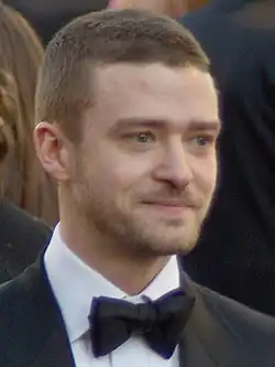 A profile picture of young blonde man who is looking forward