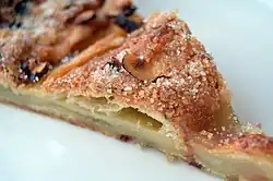 A slice of a kringle with remonce, a type of Danish pastry common in Denmark
