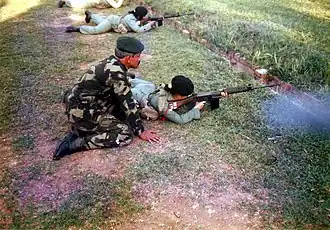 A female soldier of the Rejimen Askar Wataniah with an L1A1 SLR, circa 1990s