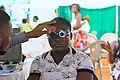 a patient wearing trial frame while doing refraction