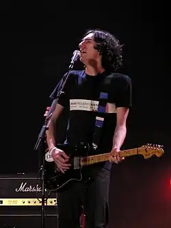 A man playing a guitar.