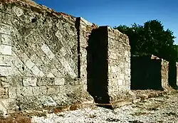 Façade of the Limes Gate with opus reticulatum masonry (1995)
