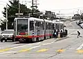 Passengers board a train at San Jose and Geneva, 2018