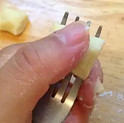 Pieces are shaped with a fork or gnocchi board.