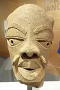 Male head; 550–50 BC; terracotta; Brooklyn Museum (New York City, USA). The mouth of this head is slightly open. It may suggest speech, that the figure has something to say. This is a figure that seems to be in the midst of a conversation. The eyes and the eyebrows suggest an inner calm or an inner serenity.