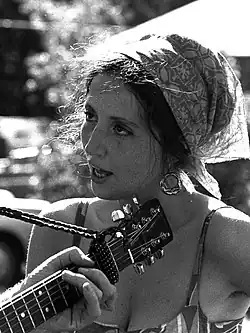 Muldaur listening to music after Memorial Day weekend on the North Shore north of Boston, 1969