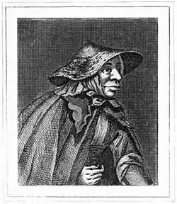 A half-length monochrome portrait of an elderly woman. She wears a wide-brimmed hat, and has a large nose and well-fleshed mouth