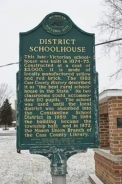 The Michigan Historical Marker that is placed on the grounds of the Mason School House.