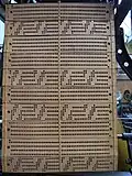 The Jacquard cards control the heads on a loom.