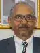 Headshot of a suited Mahmoud Hassan Saad in an indoor environment