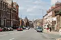 Liverpool's inner city has Georgian terraced streets. Wellington Rooms to the right, Royal Liver Building in the distance