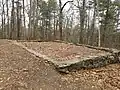 Foundation of James DeNormandie's cabin from the mid-20th century on the summit of Mount Misery