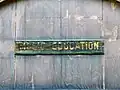 A sign reading "Music Education" on its respective building