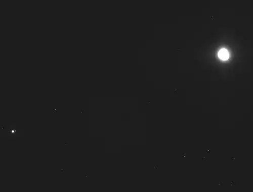 Earth-Moon (lower left) and asteroid Bennu (upper right) (December 2018)[122]