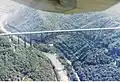 The New River Gorge Bridge as seen from a small fixed-wing airplane. The Tunney Hunsaker Bridge is also visible.