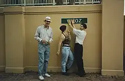 Image 32Trio in 1995 wearing neutral-colored tops and relaxed-fit, slim-leg pants and jeans. (from 1990s in fashion)